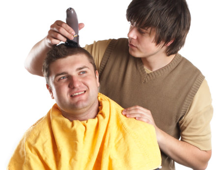 hairdresser cutting her customers hair